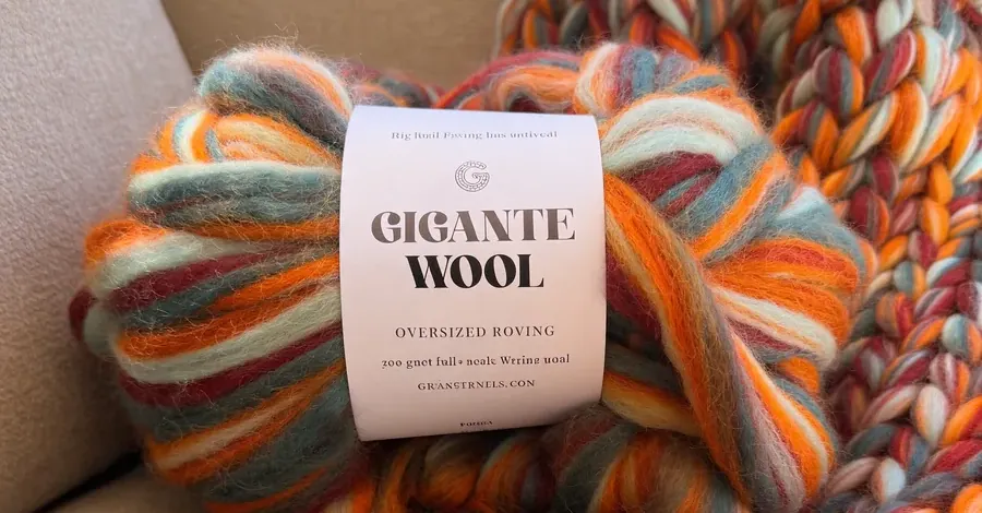 A ball of Gigante Wool hand-prepped oversized roving beside a finished chunky knit.