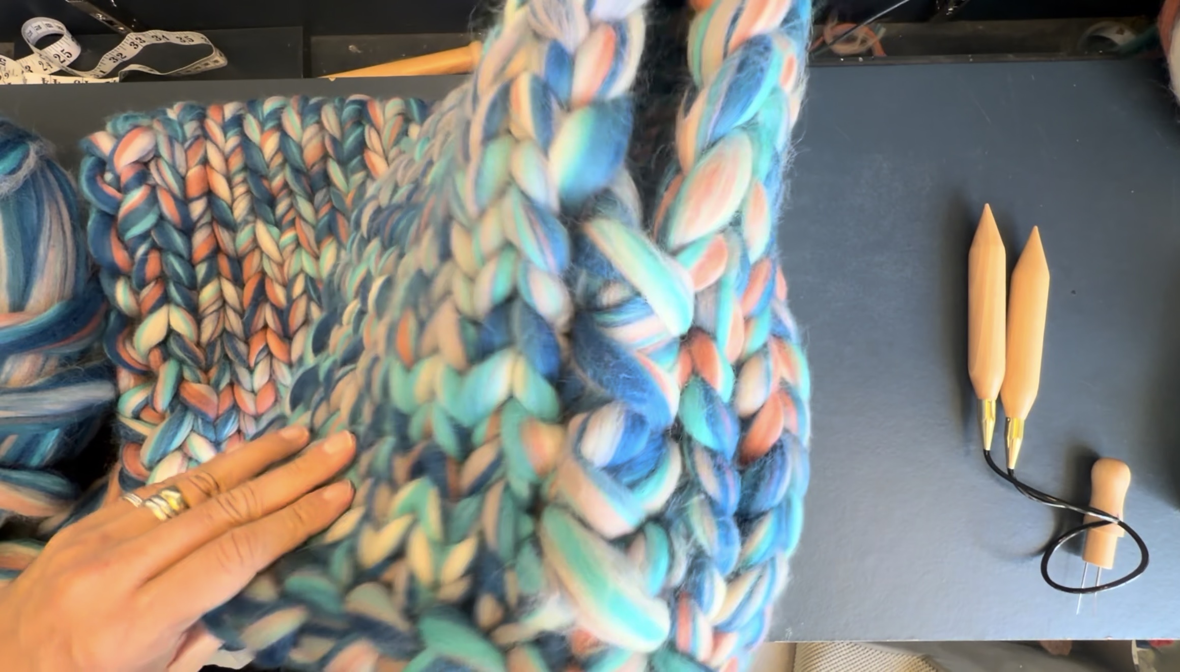 Two chunky-knit panels joined together along the side seam.