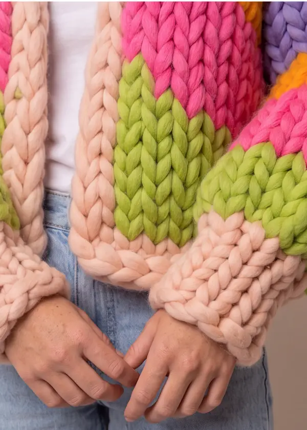A close view of the Parade's giant stitches where pink, lime and peach meet.