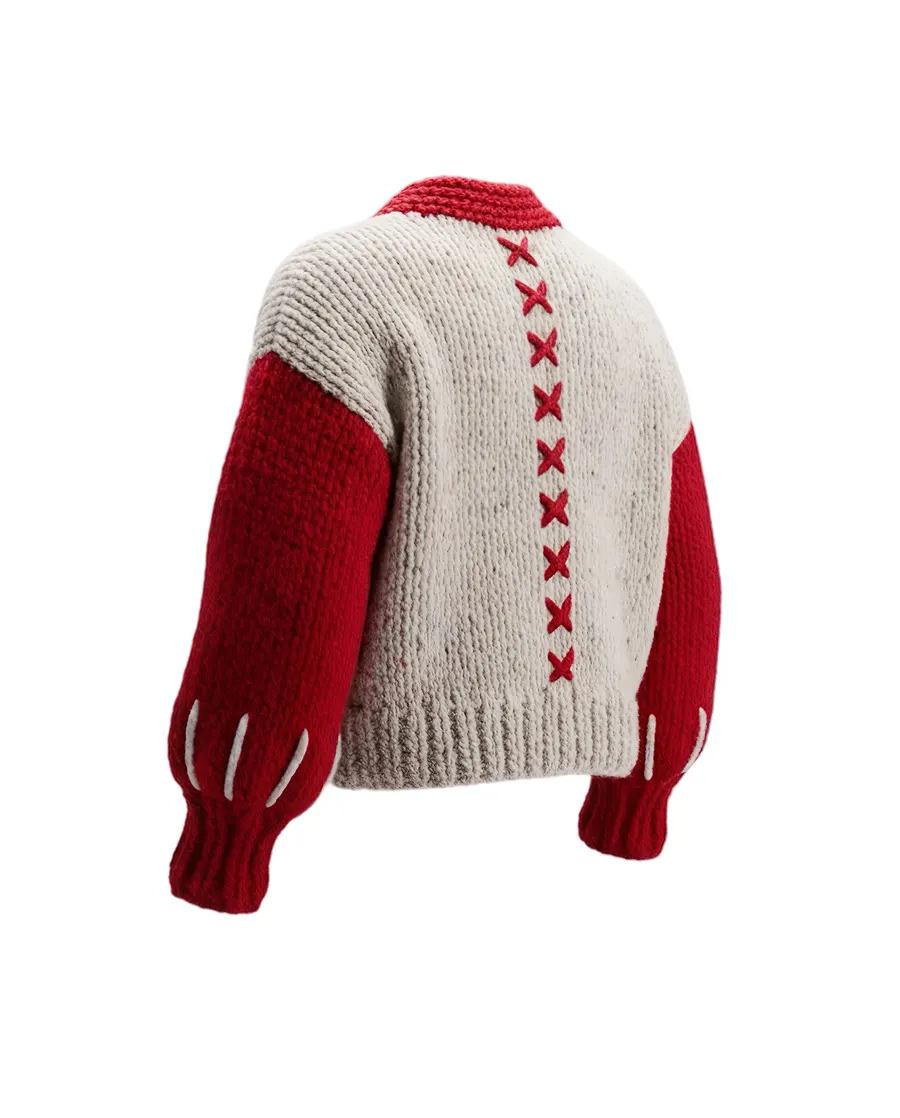 The Sovereign cardigan, back view showing the red X seam detail down the back panel.